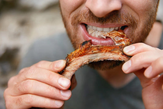 Man eating barbecue ribs meat delivery service